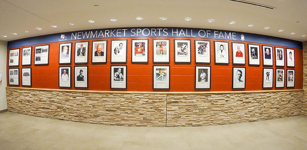 Headshots on the Newmarket Sports Hall of Fame wall